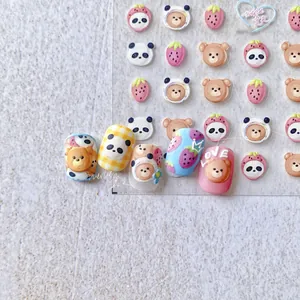 Detail of 5D cute panda and strawberry nail stickers set with colorful 3D bear patterns