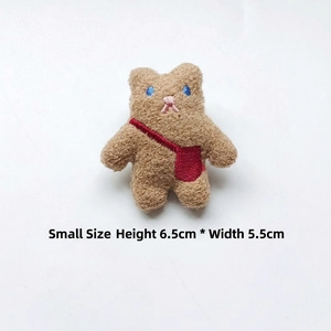 Detailed view of small brown plush bear badge showing dimensions H 6.5cm and W 5.5cm