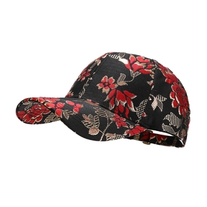 Retro baseball cap with red floral embroidery and golden lines on black fabric