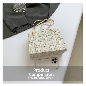 Macro detail of cream tweed texture with gold chain strap on the square tote bag