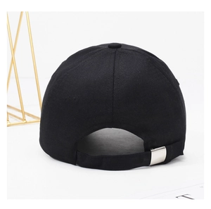 Detail of adjustable metal buckle and black twill fabric strap on classic baseball cap