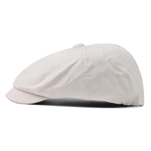 Classic cream cotton newsboy cap with vintage octagonal stitch and button top