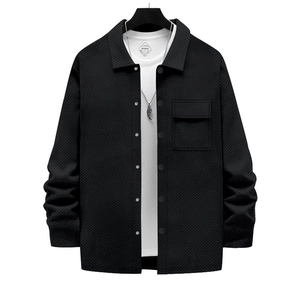 Detailed view of the heavy twill texture and chest pocket on this black men's shirt jacket