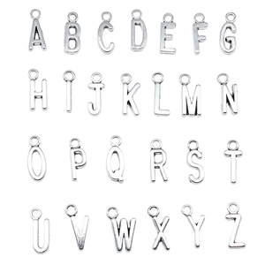 Set of 26 silver alloy A-Z alphabet charms for DIY jewelry making on white background