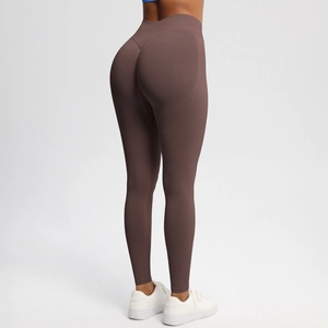 Macro detail of seamless mocha brown yoga leggings showing peach lift stitch and high waist