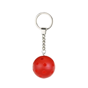 Vibrant red plastic pickleball keychain with silver metal ring on white background