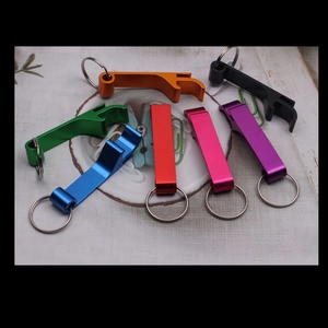 Macro view of multi-colored metal keychain beer bottle openers in a fan-shaped arrangement
