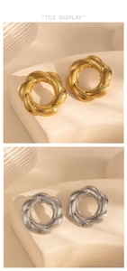 Dettaglio di orecchini a cerchio intrecciati in finiture metalliche oro e argento