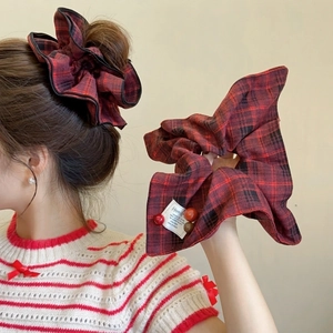 Plaid scrunchie hair tie with decorative beads in red and brown autumn colors