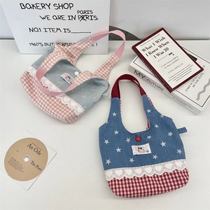 Close-up of lace-trimmed plaid tote bags with star patterns and button closures