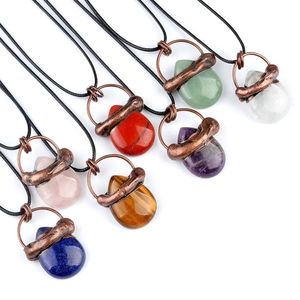 Set of waterdrop crystal pendants wrapped in copper wire on black cord necklaces