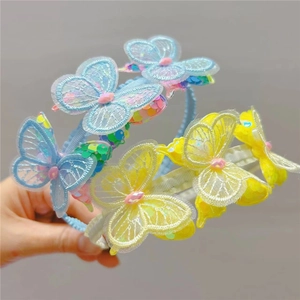 Detail of sequined mesh butterfly embroidery on light blue and yellow headbands