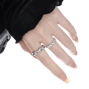 S925 sterling silver twisted knot rings in woven open design on model's hand