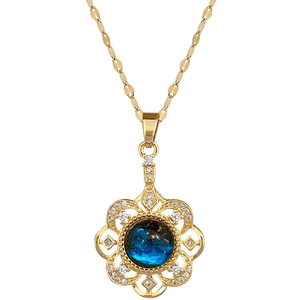Luxurious gold flower pendant necklace with dark blue stone and zircon crystals