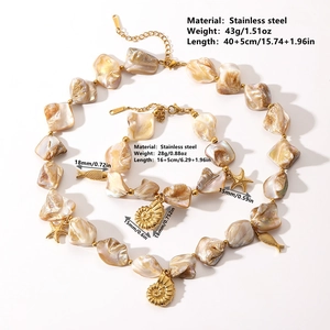 Golden stainless steel ocean jewelry set with shell beads and starfish charms