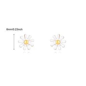 Detailed size view of white daisy earrings with golden center measuring 6mm in diameter