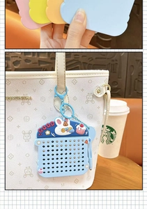 Creative mini bunny magnetic ball drawing board keychain shown as a blue bag charm