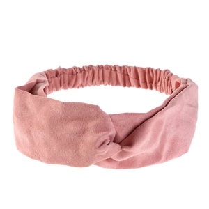 Detail view of pink twisted wide headband with elastic back and soft suede texture