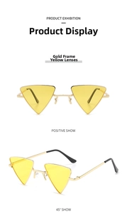 Detail of trendy triangle sunglasses with thin gold metal frame and yellow transparent lenses