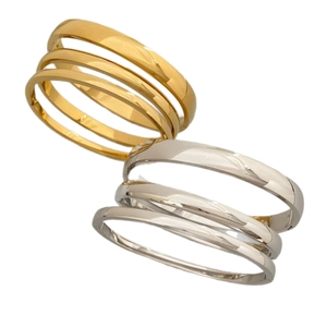 Minimalist stackable titanium steel bangles set in gold and silver polished finishes