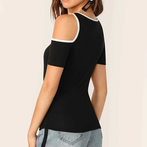 Detail of black cold shoulder top with white trim and cut-out back design for women