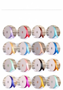 Detailed view of 16 colored polyester ribbon rolls for gift wrapping and DIY crafts