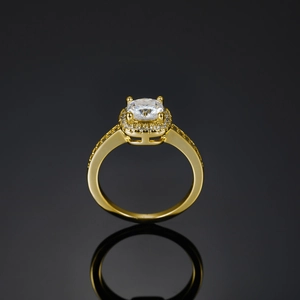 Macro detail of a 18K gold plated square moissanite ring with halo micro-pave setting