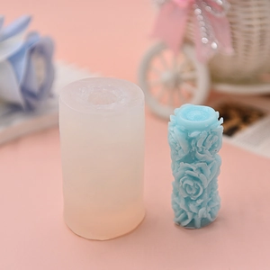 Detailed macro view of a rose embossed silicone mold with a finished blue floral candle
