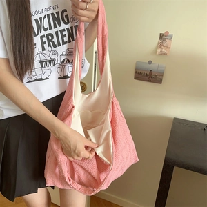 Close-up of pink bubble texture tote bag showing spacious interior and inner pocket