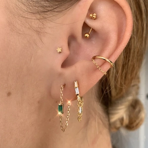 Detailed close-up of S925 silver gold-plated tassel earrings with square zircon pendant