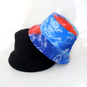 Detail view of foldable bucket hats in classic black and blue-red-white tie-dye print