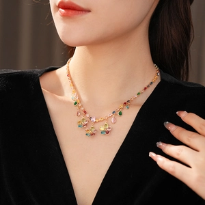 Close-up of a luxury zircon flower necklace with colorful gemstone waterdrop pendants