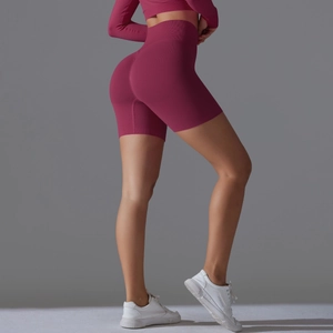 Detail of high waisted seamless yoga shorts with peach butt lift and ribbed knit texture