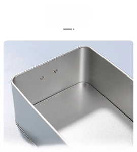 Close-up of durable silver rectangular tin box made of thick frosted tinplate material