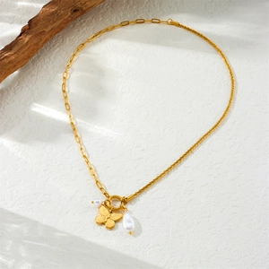 Gold asymmetrical chain necklace with butterfly pendant and white teardrop pearl