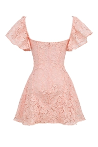 Detail view of pink lace dress back with delicate crochet patterns and hidden zipper