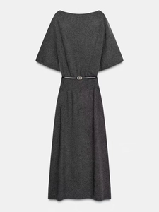 Detailed flat lay of gray knit midi dress with black belt and elegant batwing sleeves