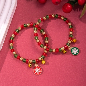 Close-up of Christmas beaded bracelets with red green crystal beads and snowflake charms