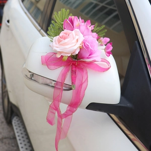 Pink faux rose wedding car mirror decoration with sheer gold-edged ribbons for elegance