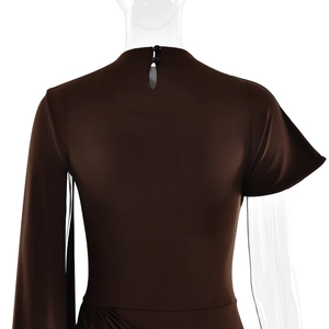 Detail of dress back with teardrop cutout, snap button and waist pleats on brown fabric
