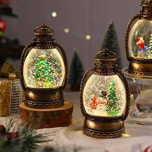 Detail of vintage bronze Christmas lantern globe with glitter and festive figurines