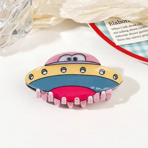 Close-up of a colorful UFO acrylic claw clip with a glossy finish and eye detail