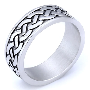 Macro shot of Viking Celtic knot pattern on wide stainless steel band with polished finish
