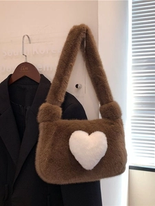 Brown faux fur shoulder bag with white heart pattern for autumn and winter outfits