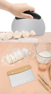 Macro detail of stainless steel dough scrapers with wooden and plastic handles on pink surface