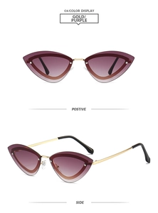 Cat-eye sunglasses with gold metal temples and purple gradient lenses in macro detail view