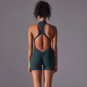 Detail view of the scrunch butt lifting design on the dark green yoga bodysuit