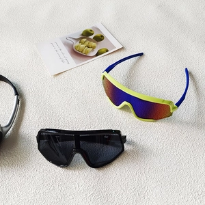 Kids cycling sunglasses in black and fluorescent green blue with gradient lenses