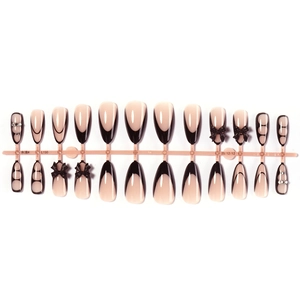 Long almond press-on nails in black and pink with 3D bows and rhinestone accents
