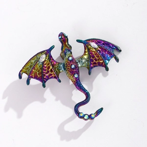 Macro detail of rainbow plated dragon brooch featuring iridescent rhinestones and alloy texture